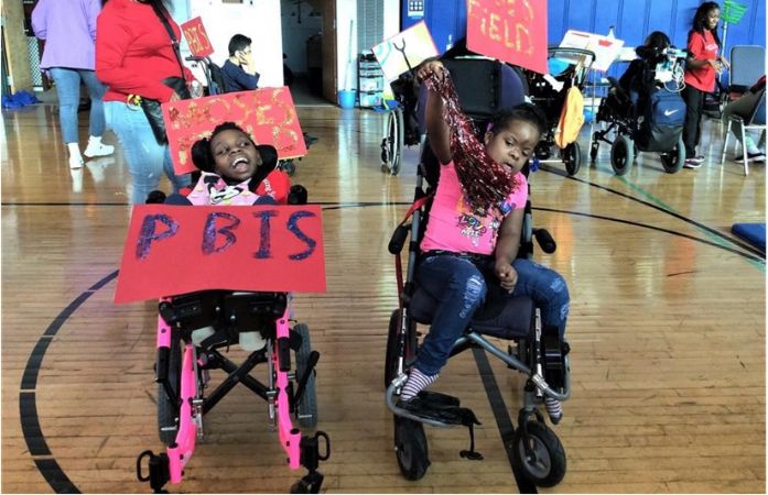  Students holding rally posters